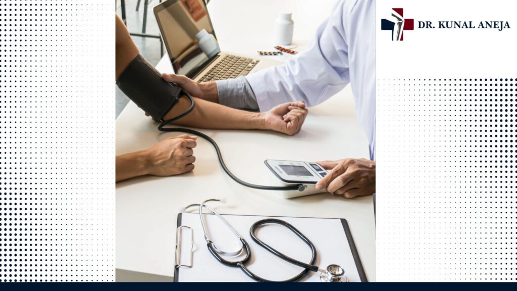 Dr Kunal Aneja explaining orthopaedic treatment options to a patient in West Delhi